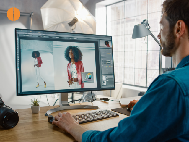 A photographer editting a photograph on editting software such as Lightroom or Photoshop. 